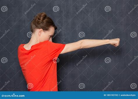 Portrait Of Angry Furious Young Woman Holding Fists Clenched Stock