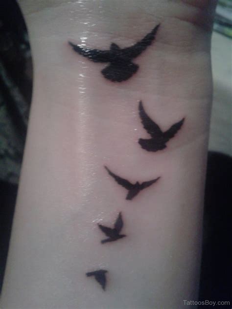 Flying Birds Tattoo On Wrist Tattoo Designs Tattoo Pictures