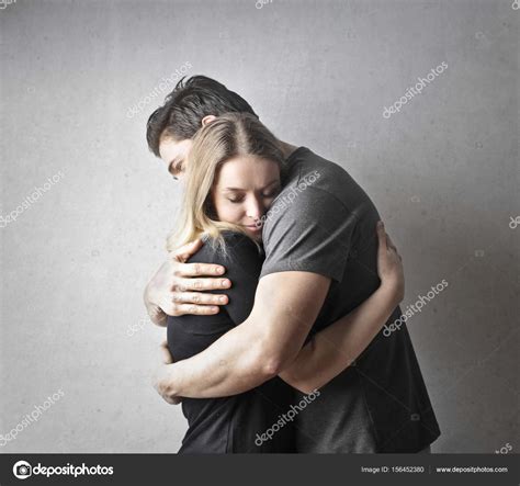 Young Couple Hugging Each Other — Stock Photo © Olly18 156452380