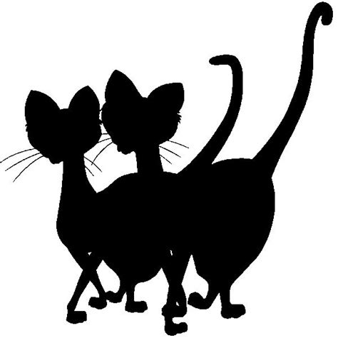 Two Black Cats Standing Next To Each Other With Their Tails Curled In