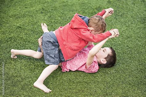 Two Boys Fighting Children On The Sports Field Stock Photo Adobe Stock