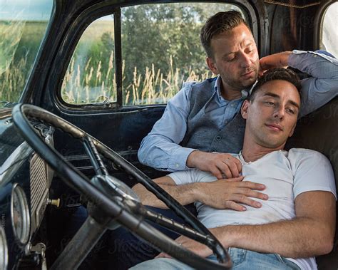 Gay Men Cuddling Romantically In Vehicle By Stocksy Contributor