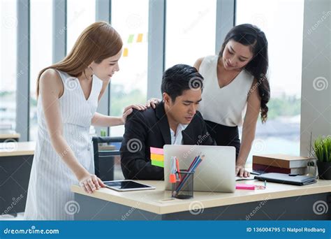 Businesswoman Gestures And Consolation Businessman In The Office Team