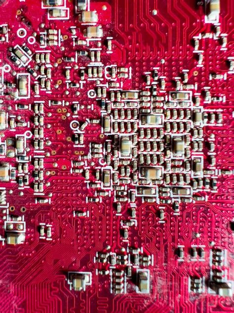 Close Up Of Transistors And Microchips On The Red Circuit Board Stock