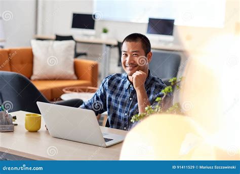 Smiling Asian Architect At Work In A Modern Office Stock Image Image