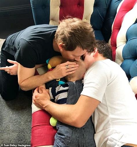 tom daley 26 shares adorable snap with husband dustin lance black 45 as they cuddle robert