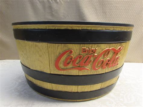 Large insulated ice bucket have a handle also known as bail which significantly eases carrying them from one point to the other. Lot Detail - LARGE INSULATED COCA COLA BARREL ICE BUCKET