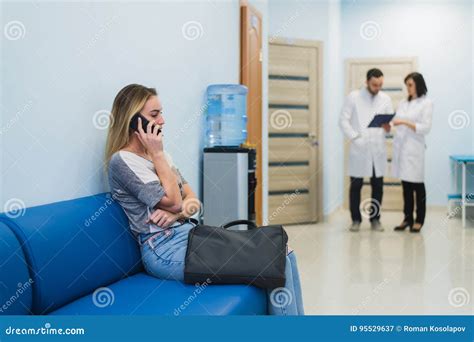 Woman Patient Waiting At Hospital Doctors Waiting Room Stock Image