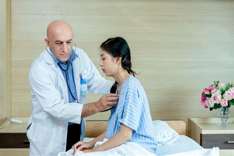 Doctor Using Stethoscope Check Up Heart Rate Woman Patient Exam