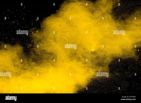 Yellow Dust Particles Explosion On Black Backgroundyellow Powder