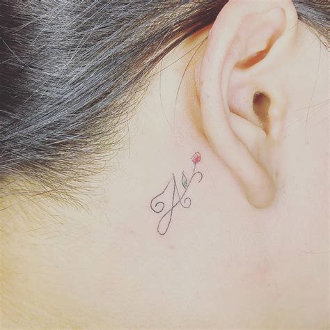 Getting a tattoo behind your ear can be painful because the area is so sensitive. 60 Charming Initial Tattoo Designs - Keep a Loved One Closer