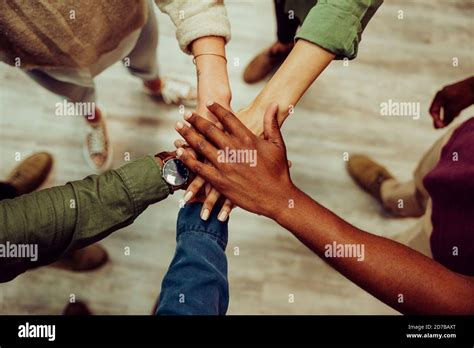 Successful Business Group Hands Stacked Together Showing Unity And Team