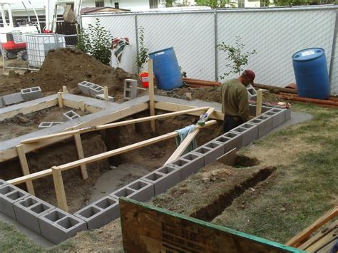 The creative pond builder can use any rigid structure in combination with a liner, to hold water, and then clad the outside with a covering of their choice. Cinder block pond walls, ALL in the ground
