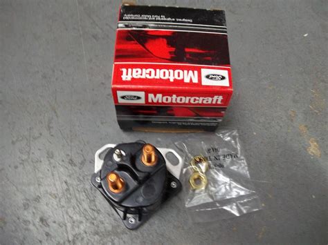 The electric starter switch is the part that is behind the part your key goes into. 2003 Ford expedition starter solenoid location