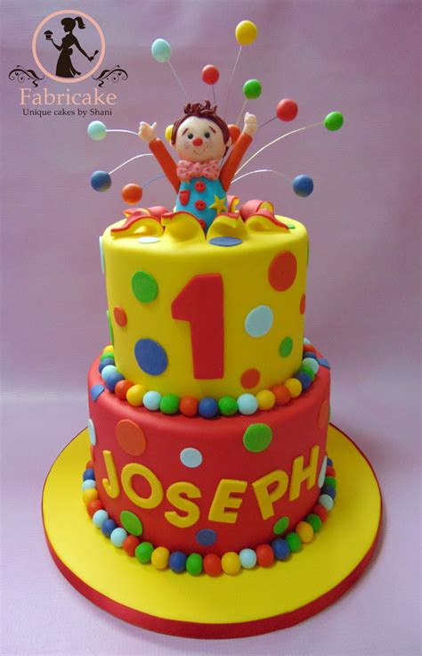 Just bake your cake in number pans, frost, and then an easy way to decorate a homemade cake is to simply add cute decorations, such as a cake topper, candles, or edible image cake topper. Mr Tumble Cake - CakeCentral.com