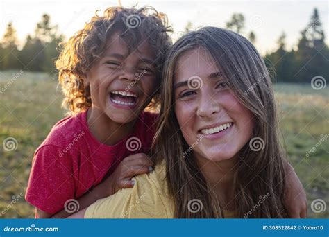 Happy Smiling Kids Outdoors A Beautiful Teenage Girl And A Diverse