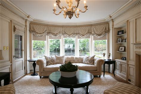 Original Paneling And Large Bay Window In This Formal Living Room