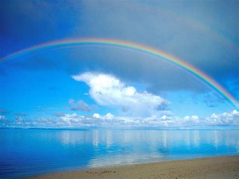 Beautiful Rainbow Over The Blue Ocean Water Sunny Summer