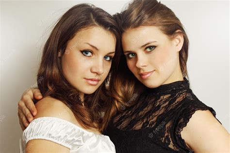 Premium Photo Two Young Girls Tenderly Embracing Each Other
