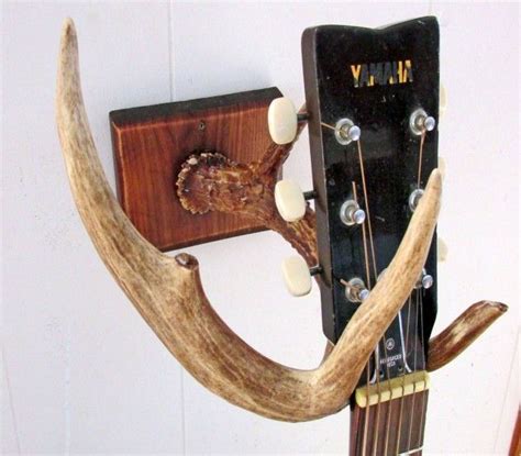 Guitar holder wall mount bracket guitar wall hanger wood hanging rack with pick holder and 3 hook carbonized timothymusicart 5 out of 5 stars (2) $ 49.99 free. DIY Guitar Wall Mount Made With A Deer Antler ...