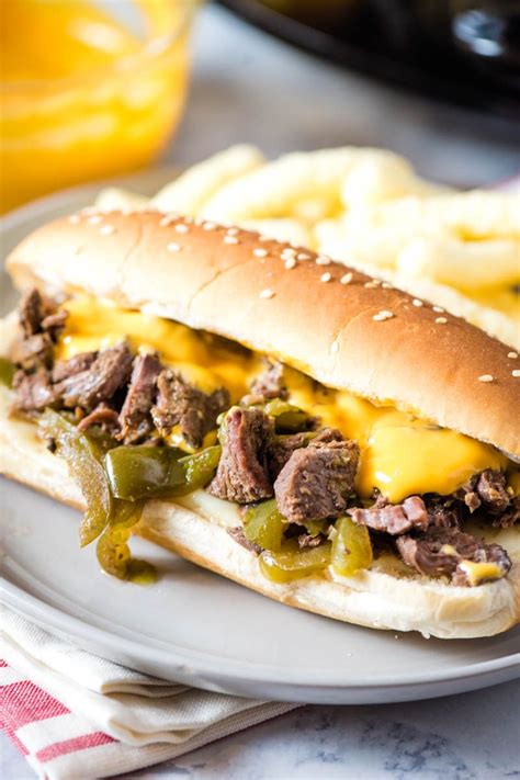 There is some debate over whether a cheese steak should be very thin slices. How to make the most delicious Crock Pot Philly cheesesteak sandwich. Easy slow cooker recipe ...
