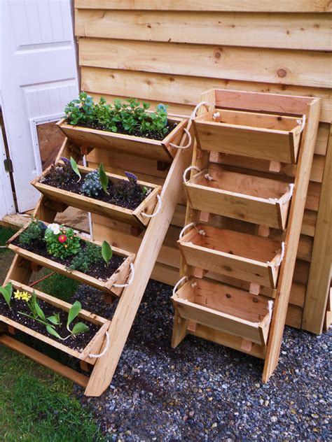 Designers suggest different solutions, including raised beds, potted plants, pyramid gardens or even wheels. large gardening planters raised bed gardening by RopedOnCedar