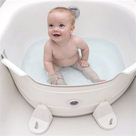Some moms enjoy breastfeeding in the bath since the warm water can help with the letdown of milk. Water-Saving Baby Baths : bathtub divider
