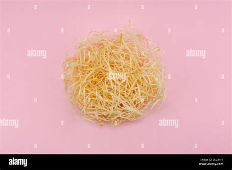 creative flat lay concept the love nest made of beige hay and one red heart is a symbol of love