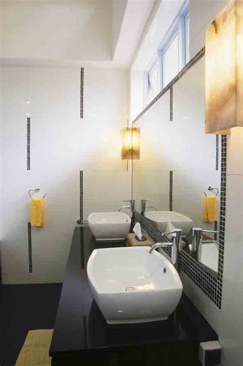 Row of modern white ceramic wash basin in public toilet with cityscape background, restroom in restaurant or hotel or shopping mall, interior decoration design. Luxury Modern Washroom Designs | Home Hub and Living