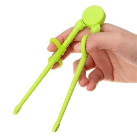 How to use chopsticks beginners. 1 pair children kids beginner training helper chopsticks ...