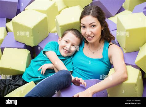 Asian Indian Mother And Son Playing With Soft Blocks At Indoor Children