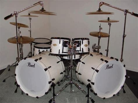 A White Drum Set Sitting On Top Of A Floor