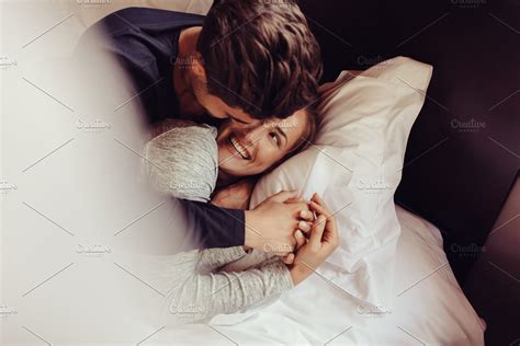 Romantic Couple In Love Lying On Bed High Quality People Images
