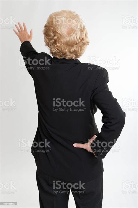 Rear View Of A Woman Extending Her Hand Stock Photo Download Image