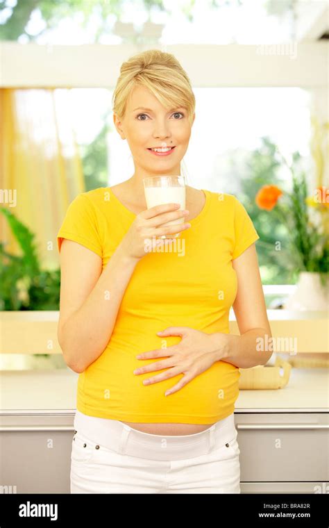 Pregnant Woman Drinking Milk Stock Photo Alamy