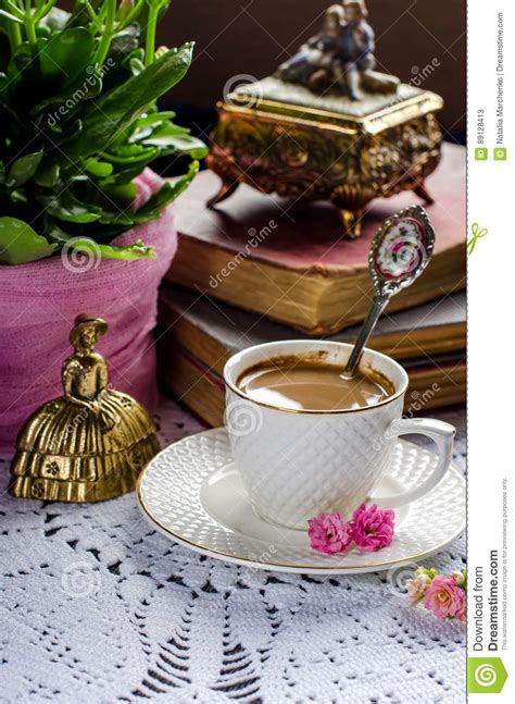 Beautiful Vintage Still Life With Flowers Books A Cup And Bell Stock