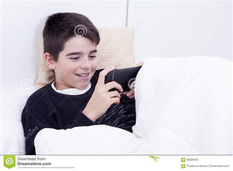Child Lying Down With The Telephone Stock Image Image Of Technology