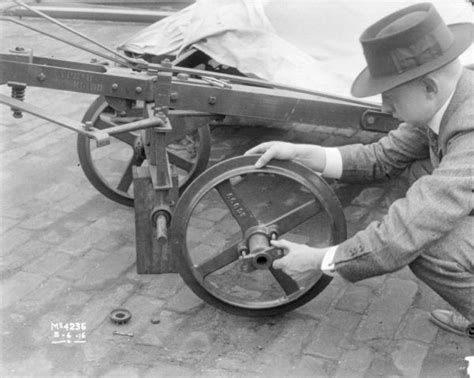 Man Mounting Wheel Onto Machine Photograph Wisconsin Historical Society