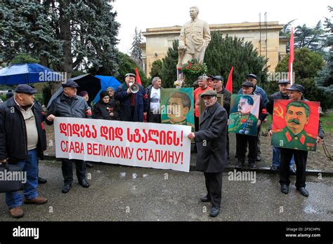 Georgians Stand With Portraits Of Former Soviet Dictator Joseph Stalin