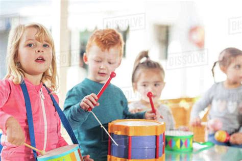 Young Children Playing With Musical Instruments Stock Photo Dissolve