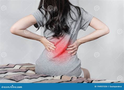 Backache And Lower Back Pain Concept Young Woman Suffering From Back