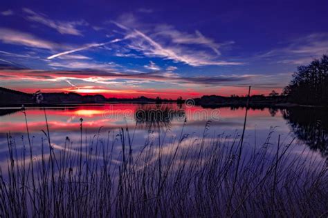 A Beautiful Sunset At A Calm And Peaceful Lake Colorful Sky Stock