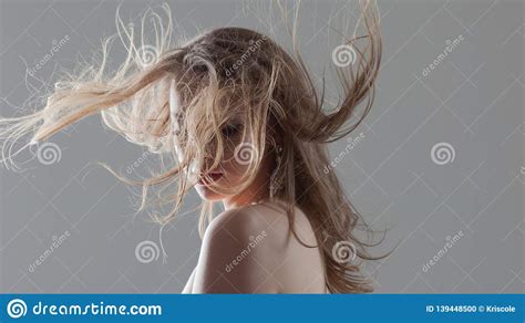 Portrait Of A Beautiful Young Woman With Flying Curls Girl With
