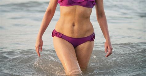 fit at fifty nancy dell olio recreates iconic bond pose in skimpy bikini mirror online