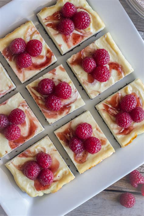 Swirled with raspberry jam, raspberry cheesecake is as pretty to look at as it is delicious. Raspberry Swirl Cheesecake Bars - Lovely Little Kitchen