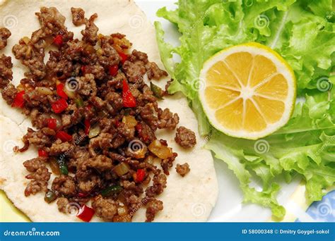 Roasted Minced Beef With Chili Pepper On Tortilla With Lettuce And