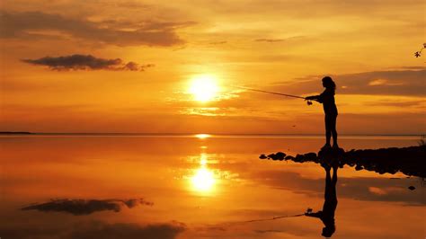 Woman Fishing On Fishing Rod Spinning At Sunset Background Stock Video