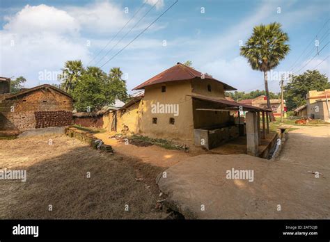 Indian Village Scene With View Of Mud Houses And Unpaved Village Road