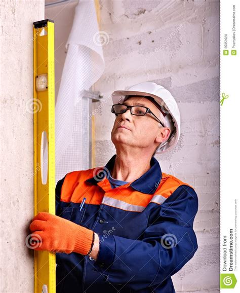 Man in builder uniform. stock photo. Image of laborer - 35353920