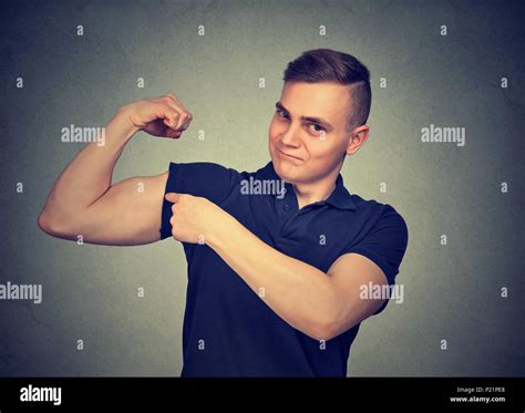 Guy Flexing Muscle Hi Res Stock Photography And Images Alamy